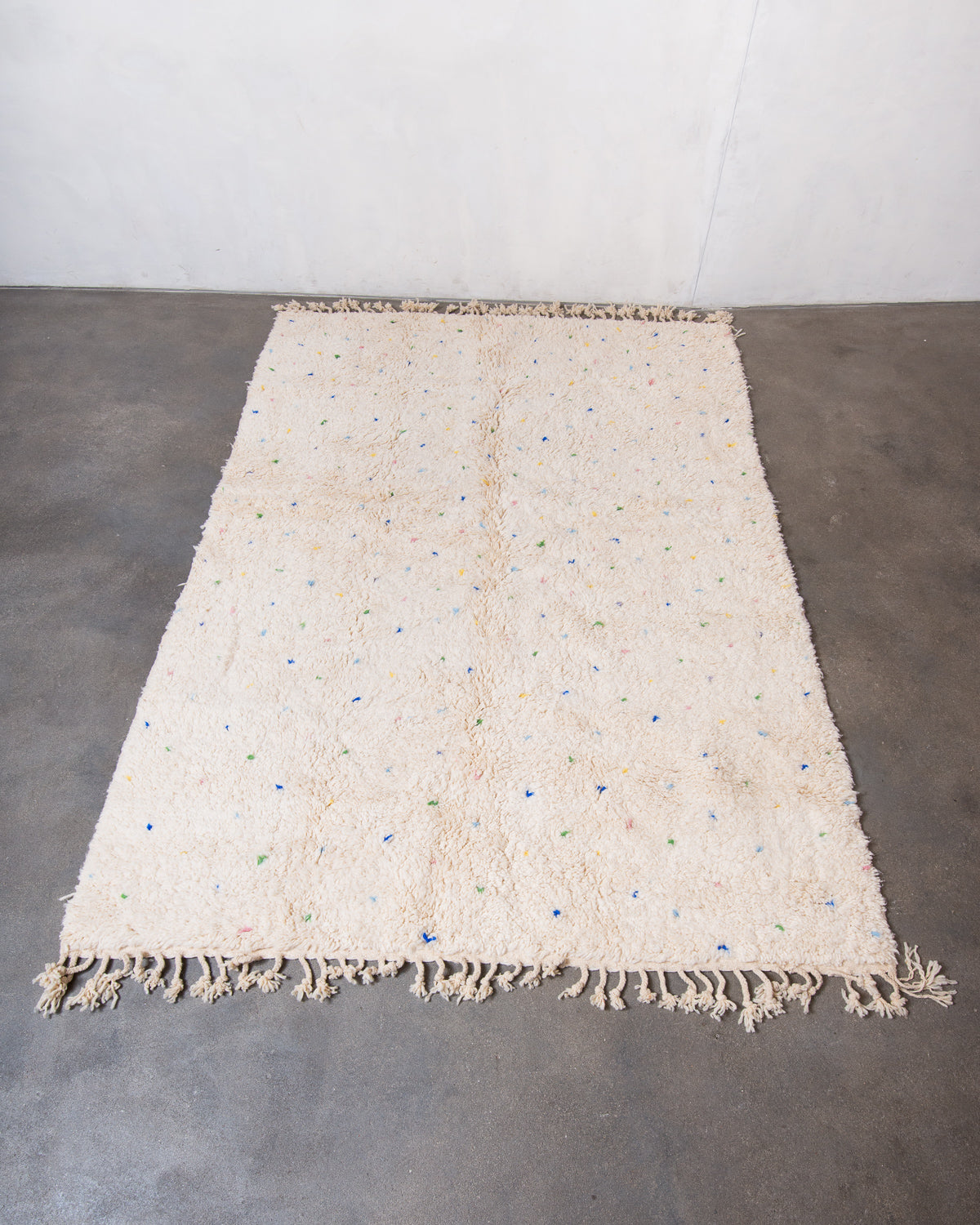 Modern, designer, handcrafted Berber rug from Morocco. Beniourain carpet with beautiful colours and patterns and fluffy wool texture.